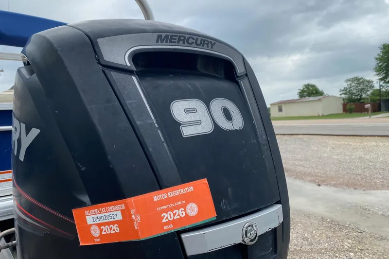 Slide: The Image of Mercury 90 outboard motor with 2026 registration sticker on Sun Tracker Fishin' Barge 22 DLX. - 5