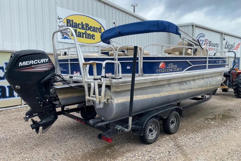 Slide: The Image of 2016 Sun Tracker Fishin' Barge 22 DLX pontoon boat with Mercury engine at BlackBeard Marine. - 6