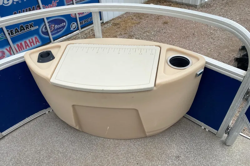 Slide: The Image of 2016 Sun Tracker Fishin' Barge 22 DLX fishing station with measuring board and cup holders. - 8