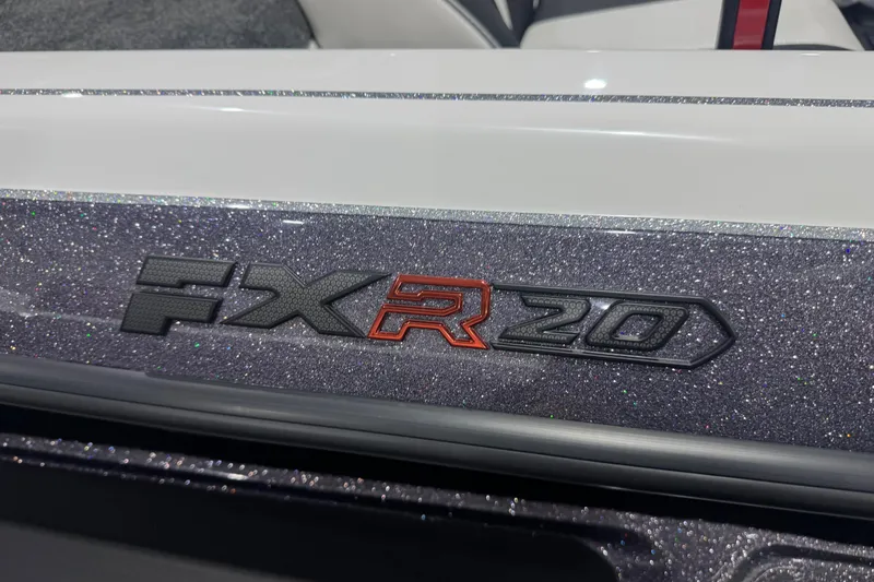 Slide: The Image of 2026 Skeeter FXR20 FLEX boat logo on glittery surface. - 2