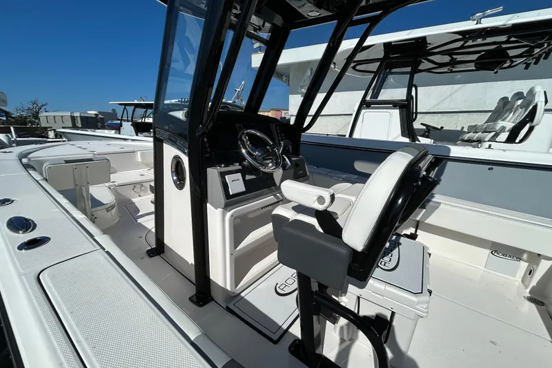 Slide: The Image of 2025 Robalo 266 Cayman boat interior with modern helm and seating. - 7