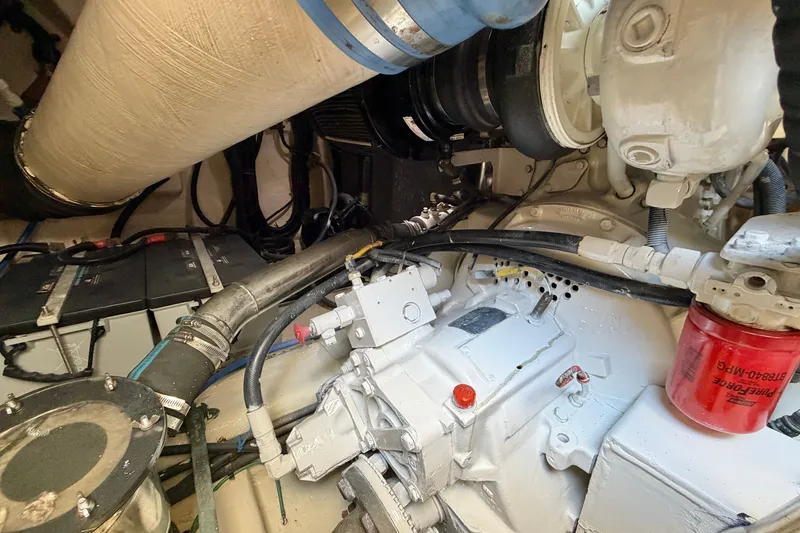 Slide: The Image of Engine room of 2004 Riviera 51 Flybridge yacht, showcasing mechanical components and systems. - 39