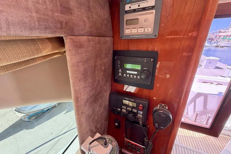 Slide: The Image of Control panel of a 2004 Riviera 51 Flybridge yacht with communication equipment. - 13