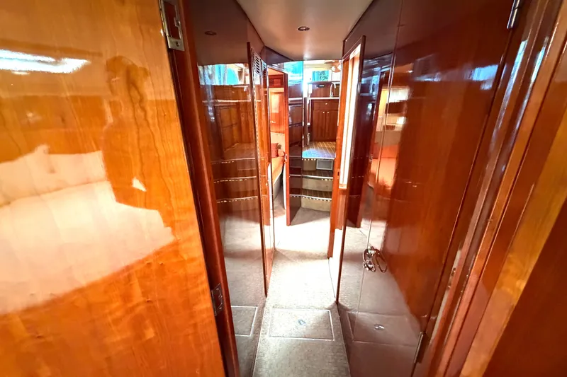 Slide: The Image of Luxurious wooden interior of 2004 Riviera 51 Flybridge yacht hallway. - 14