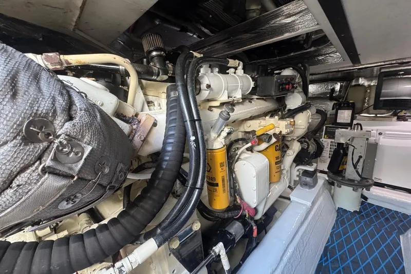 Slide: The Image of Engine room of 2004 Riviera 51 Flybridge yacht, showcasing detailed mechanical components. - 21