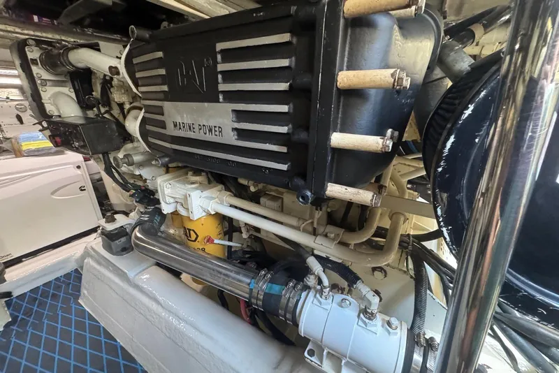 Slide: The Image of Engine room of 2004 Riviera 51 Flybridge showcasing marine power components. - 22