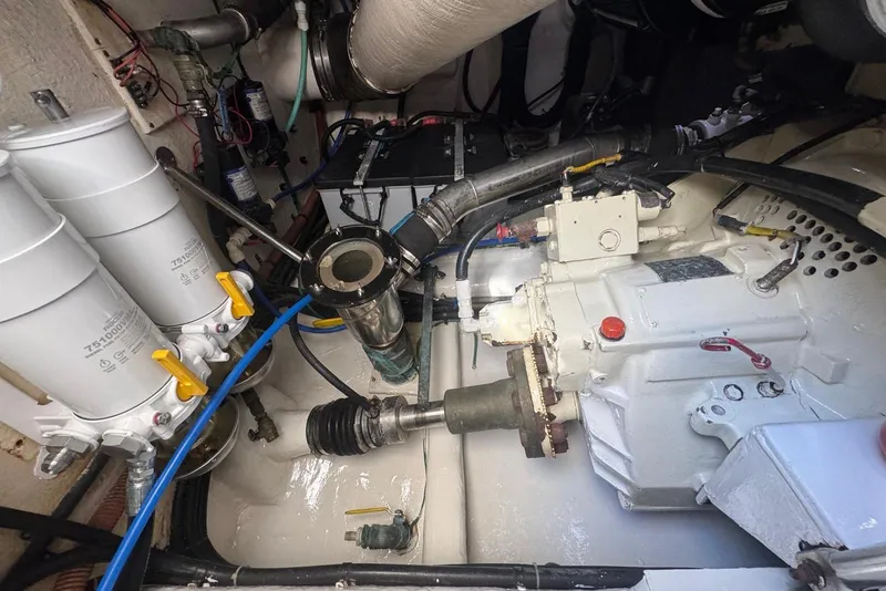 Slide: The Image of Engine room of 2004 Riviera 51 Flybridge yacht, showcasing mechanical components and systems. - 24