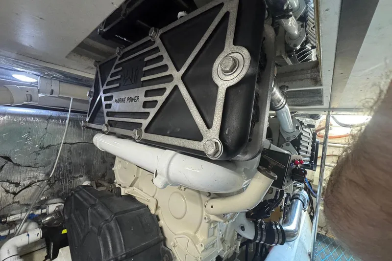 Slide: The Image of Engine room of a 2004 Riviera 51 Flybridge yacht, showcasing marine power components. - 32