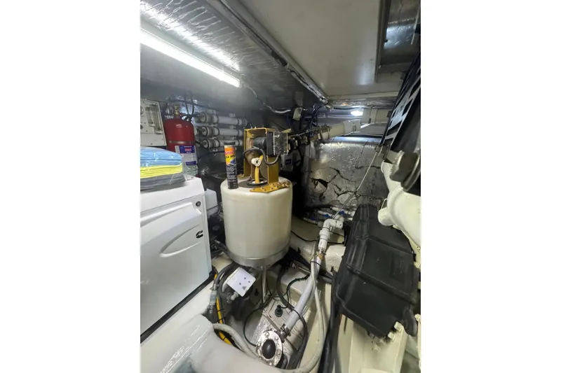 Slide: The Image of Engine room of 2004 Riviera 51 Flybridge yacht with equipment and machinery. - 33