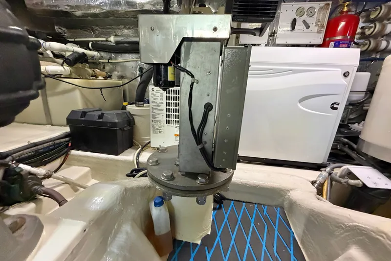 Slide: The Image of Engine room of 2004 Riviera 51 Flybridge yacht with mechanical components and wiring. - 42