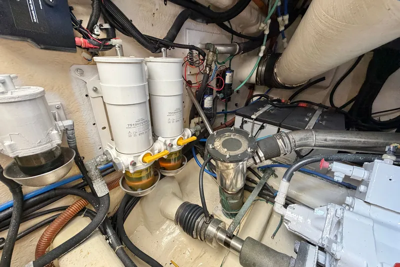 Slide: The Image of Engine room of 2004 Riviera 51 Flybridge with fuel filters and mechanical components. - 38