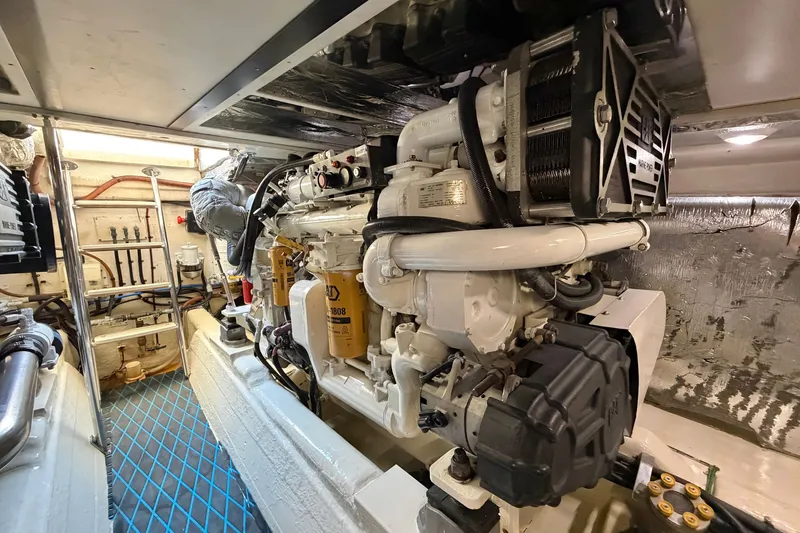 Slide: The Image of Engine room of 2004 Riviera 51 Flybridge yacht, showcasing detailed machinery and components. - 45