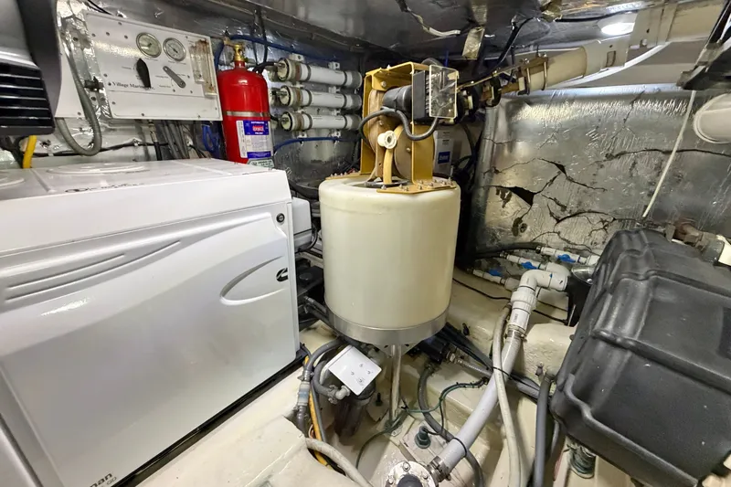 Slide: The Image of Engine room of 2004 Riviera 51 Flybridge yacht with equipment and machinery. - 44