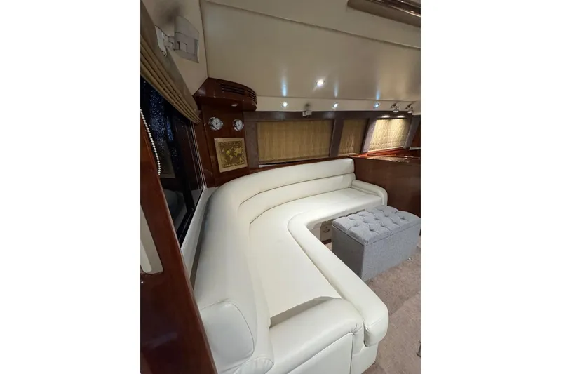 Slide: The Image of Luxurious interior of 2004 Riviera 51 Flybridge yacht with white leather seating. - 7