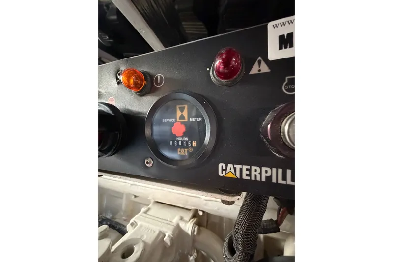 Slide: The Image of Caterpillar engine service meter on 2004 Riviera 51 Flybridge yacht dashboard. - 46