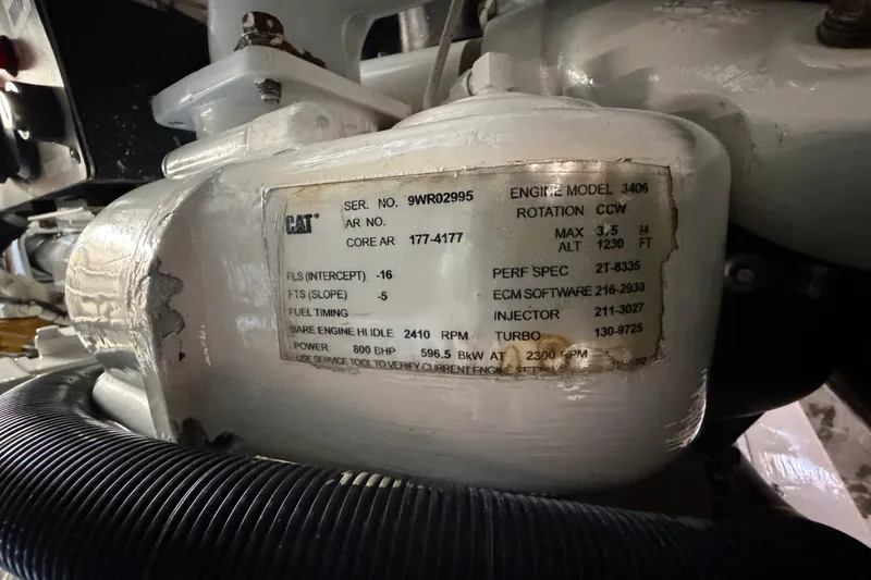 Slide: The Image of Engine label on 2004 Riviera 51 Flybridge, CAT model 3406 specifications visible. - 49