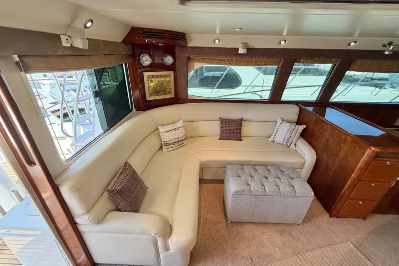 Slide: The Image of Luxurious interior of 2004 Riviera 51 Flybridge yacht with plush seating and elegant decor. - 10