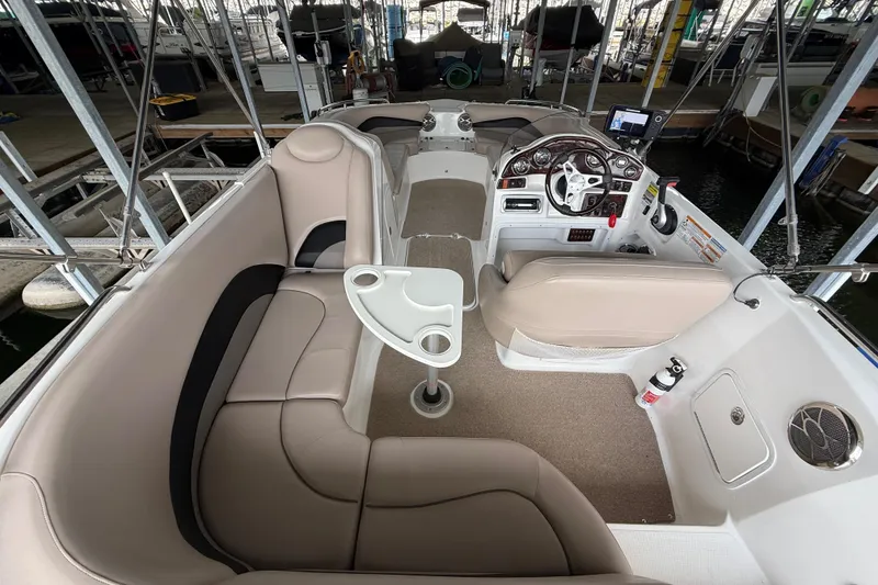 Slide: The Image of Interior of 2014 Hurricane SunDeck Sport 202 IO boat with seating and steering console. - 28