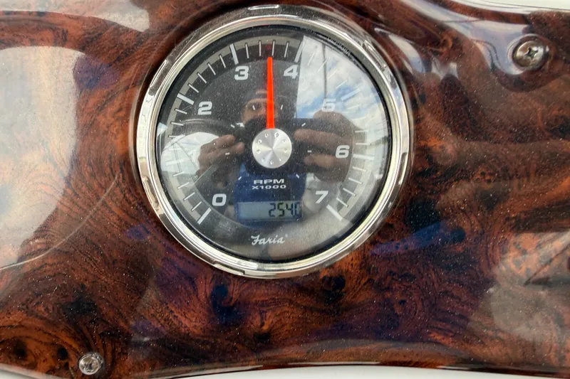 Slide: The Image of Tachometer of 2014 Hurricane SunDeck Sport 202 IO boat, showing RPM and wood grain panel. - 30