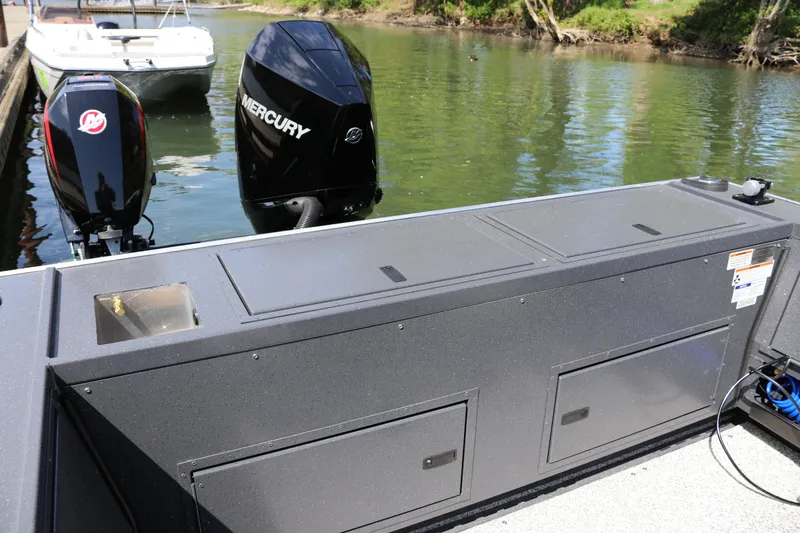 Slide: The Image of 2026 Alumaweld Pacific CC 26 boat with dual Mercury outboard motors on a calm lake. - 11