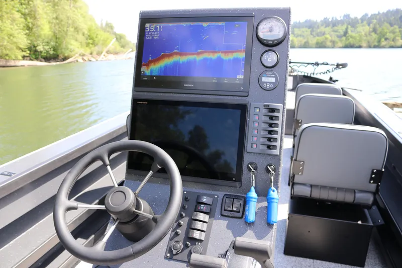 Slide: The Image of 2026 Alumaweld Pacific CC 26 boat dashboard with advanced navigation and control systems. - 12