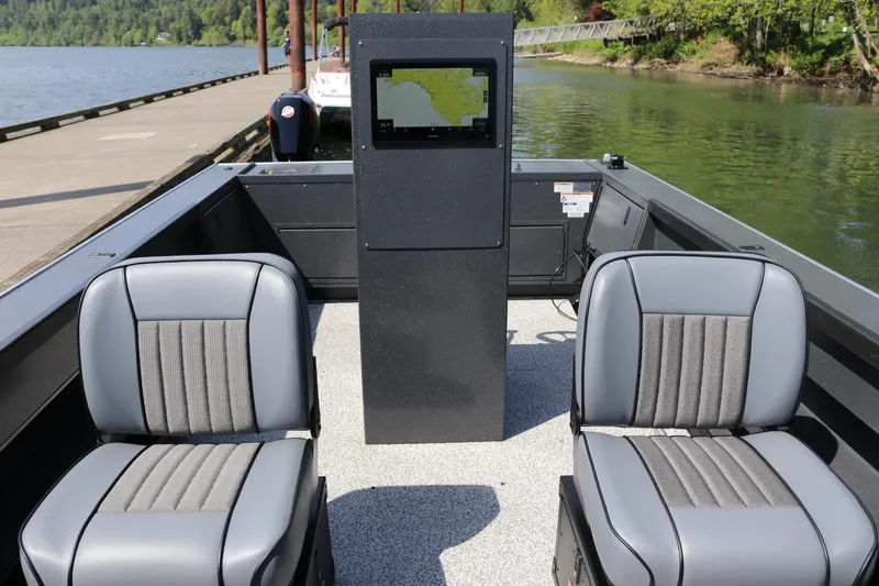 Slide: The Image of 2026 Alumaweld Pacific CC 26 boat interior with two seats and navigation display. - 9