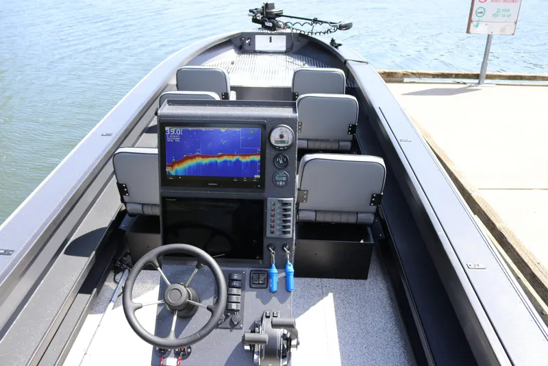 Slide: The Image of 2026 Alumaweld Pacific CC 26 boat interior with advanced navigation system and seating. - 7