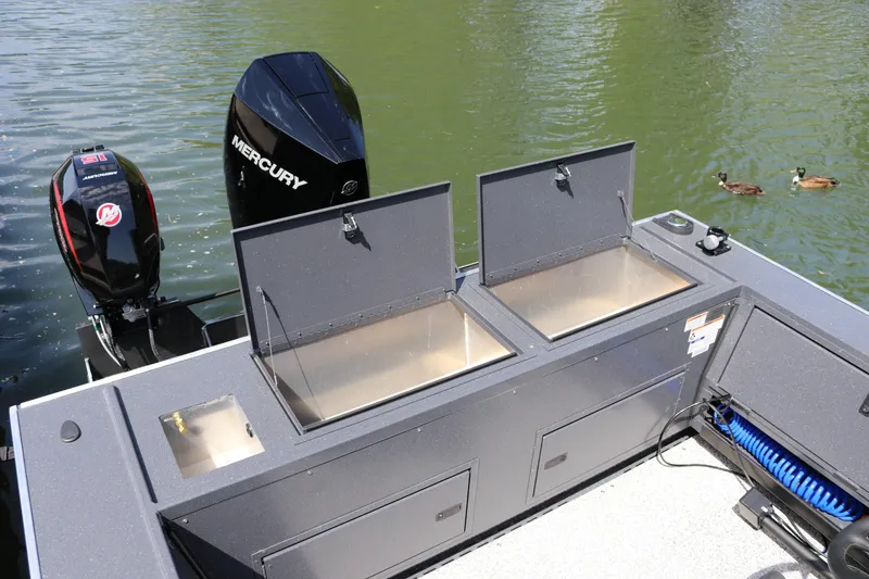 Slide: The Image of 2026 Alumaweld Pacific CC 26 boat with Mercury engines on a calm lake. - 28