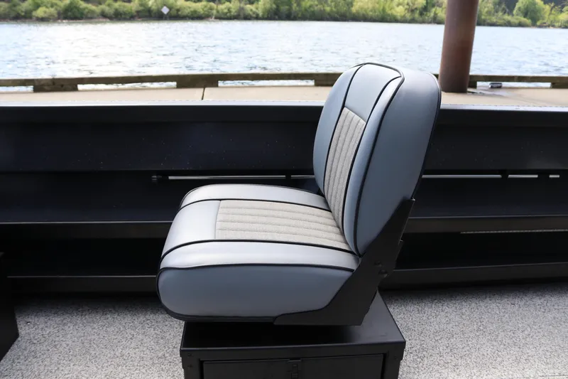 Slide: The Image of 2026 Alumaweld Pacific CC 26 boat seat with lake view in background. - 18