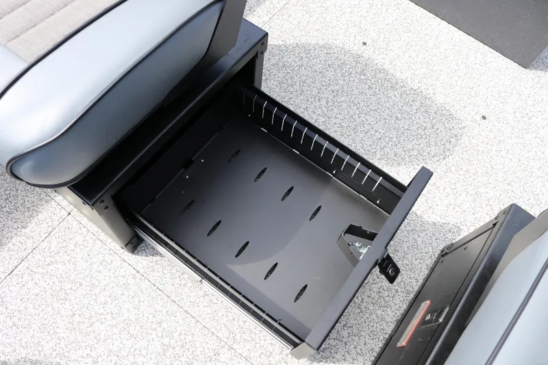 Slide: The Image of Open storage compartment in 2026 Alumaweld Pacific CC 26 boat interior. - 17