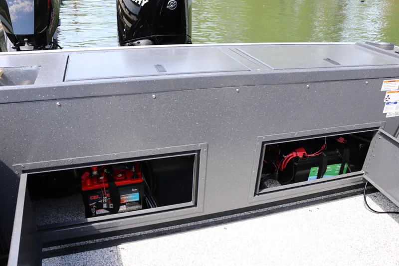 Slide: The Image of 2026 Alumaweld Pacific CC 26 boat battery compartment with dual batteries visible. - 29