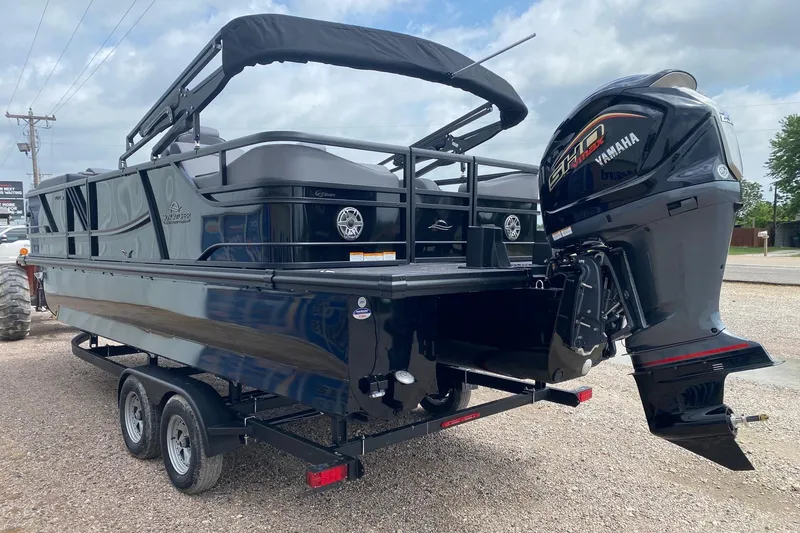 Slide: The Image of 2026 SunCatcher Elite 324 SS pontoon boat with Yamaha motor on trailer. - 3