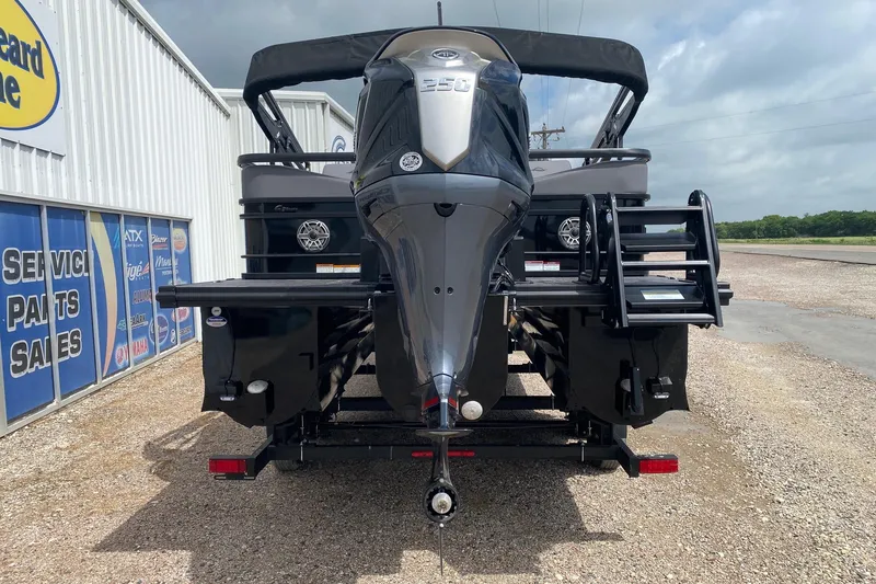 Slide: The Image of 2026 SunCatcher Elite 324 SS boat rear view with powerful outboard motor. - 4