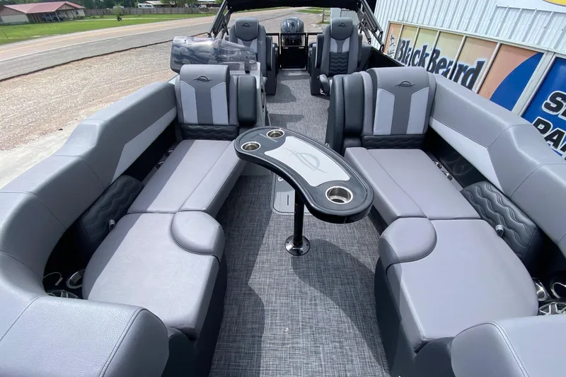 Slide: The Image of Luxurious interior of 2026 SunCatcher Elite 324 SS pontoon boat with plush seating. - 6