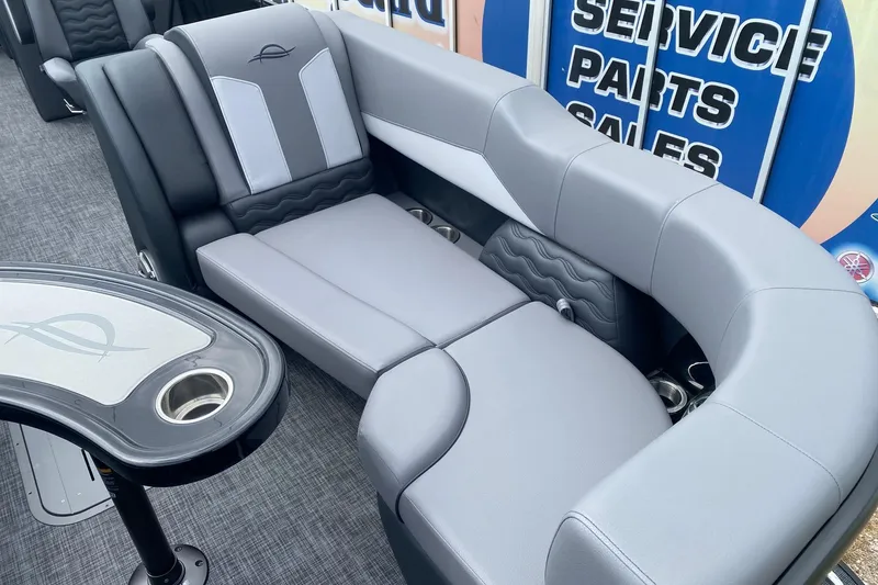 Slide: The Image of Luxurious seating on 2026 SunCatcher Elite 324 SS pontoon boat, featuring sleek gray upholstery. - 7