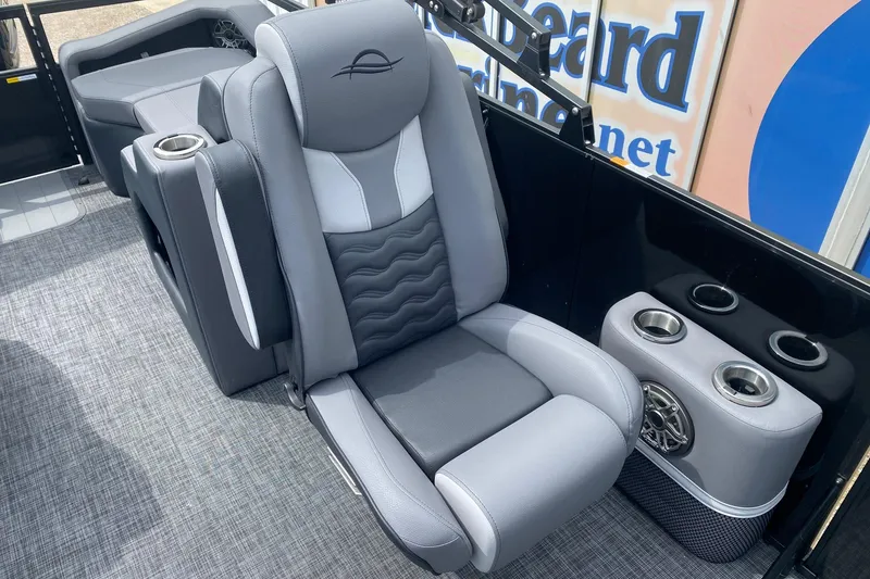 Slide: The Image of Luxurious seating on 2026 SunCatcher Elite 324 SS boat with cup holders and speaker. - 8
