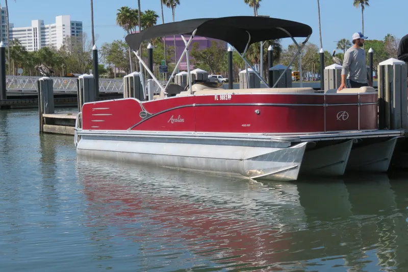 The Image of 2014 Avalon Catalina Fish 24' pontoon boat docked in a marina. - 0