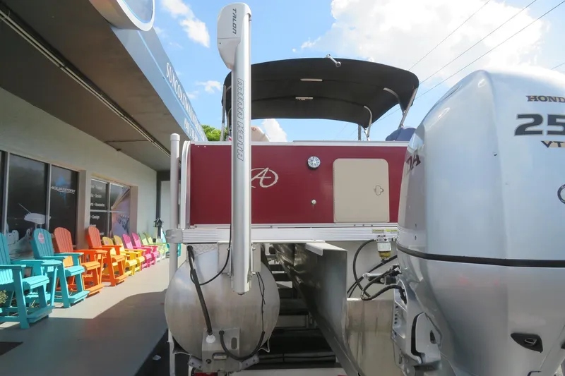 Slide: The Image of 2014 Avalon Catalina Fish 24' boat with Honda 250 engine at dealership. - 10