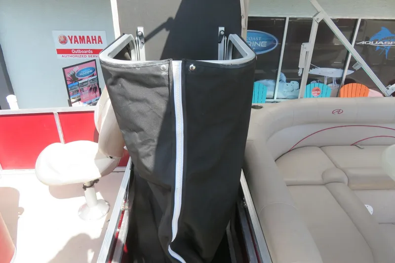 Slide: The Image of 2014 Avalon Catalina Fish boat interior with seating and storage compartment. - 19