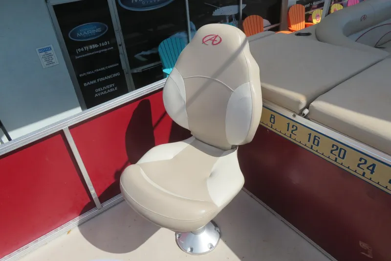 Slide: The Image of Beige captain's chair on 2014 Avalon Catalina Fish 24' boat, near measuring ruler. - 20