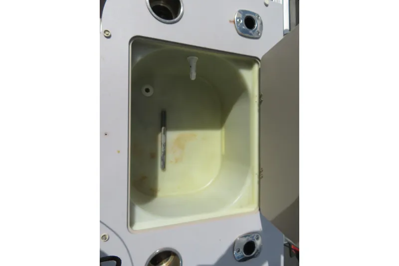 Slide: The Image of Open storage compartment on 2014 Avalon Catalina Fish 24' boat. - 23