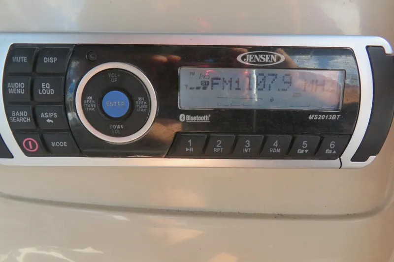 Slide: The Image of Jensen stereo system on 2014 Avalon Catalina Fish boat, displaying FM 107.9. - 29