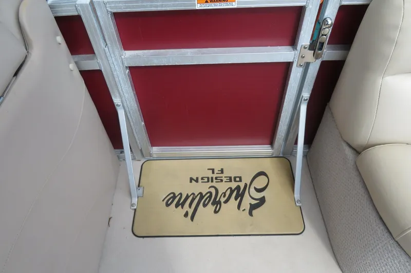 Slide: The Image of Interior of 2014 Avalon Catalina Fish boat with beige seating and custom floor mat. - 32