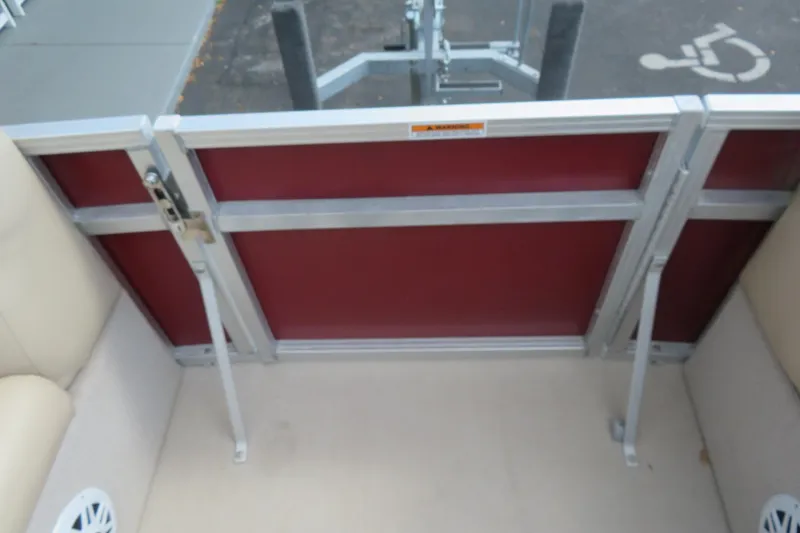 Slide: The Image of 2014 Avalon Catalina Fish 24' boat interior with red gate and beige seating. - 34