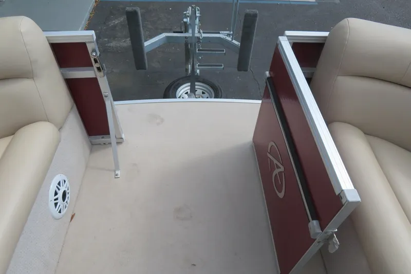 Slide: The Image of 2014 Avalon Catalina Fish 24' boat interior with beige seating and red paneling. - 35