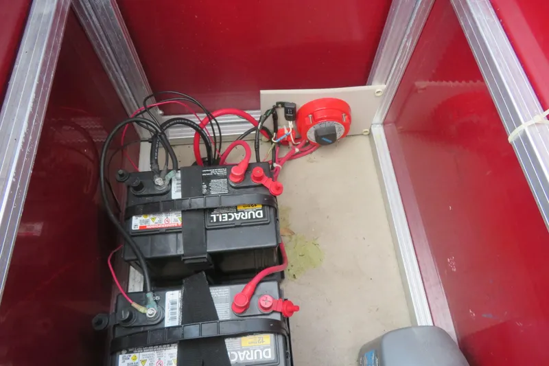 Slide: The Image of Battery compartment of 2014 Avalon Catalina Fish 24' boat with wiring and connections. - 38