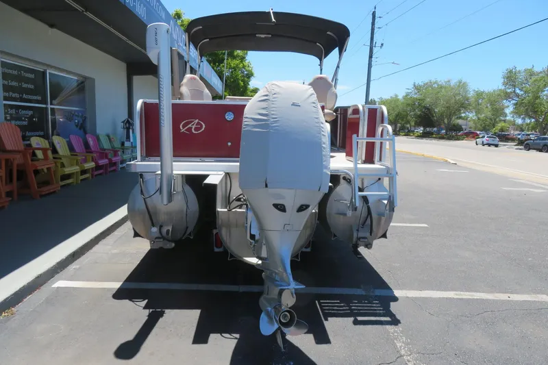 Slide: The Image of 2014 Avalon Catalina Fish 24' pontoon boat parked outside a store. - 7
