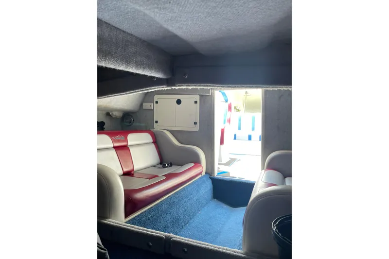 Slide: The Image of Interior of 2007 Eliminator 30 Daytona boat with red and white seating. - 15