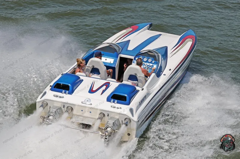 Slide: The Image of 2007 Eliminator 30 Daytona speedboat cruising on water with passengers. - 3
