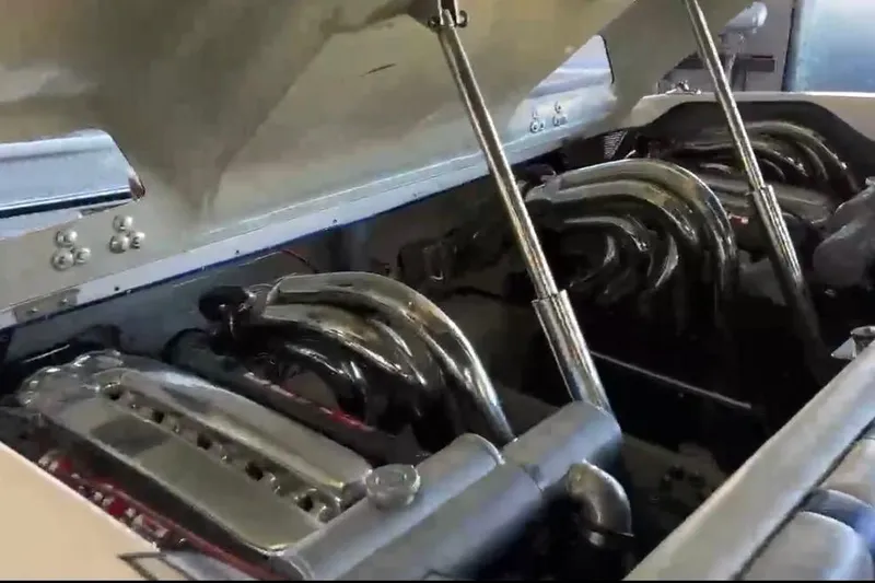 Slide: The Image of Engine compartment of a 2007 Eliminator 30 Daytona boat with polished components. - 9